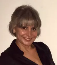 A headshot of Alexandra Rodrigues